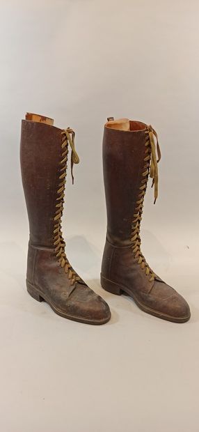 null Two pairs of laced brown leather boots called aviator's boots, studded soles....