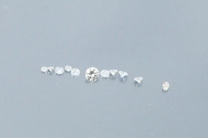 Set of 12 small diamonds on paper. 
Total...