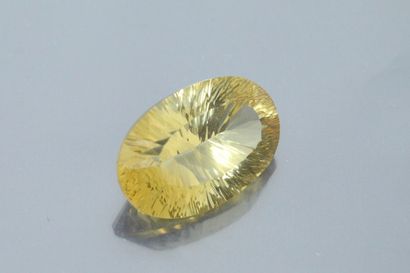 null Oval concave citrine on paper.

Weight: 53.47 cts.