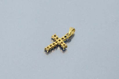 null Baby cross, 18k (750) yellow gold setting with synthetic blue stones.

Ht.:...