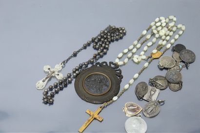 null Two rosaries and a set of small religious medals.