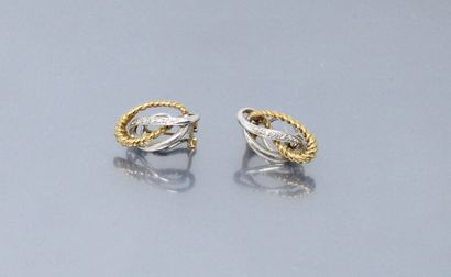 null Pair of 18k (750) yellow and white gold openworked ear studs partially torn...