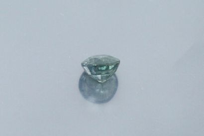 null Round blue-green sapphire on paper. 

Accompanied by a GIA certificate indicating...