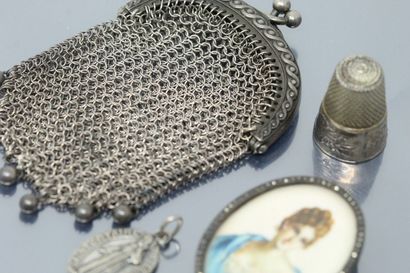 null Set of small silver objects including: a knitted purse, a thimble, a miniature...