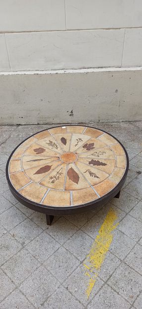  Roger Capron 
Oval coffee table called "Herbarium" resting on four wooden legs,...