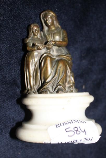 null L'éducation de la Vierge Statuette en bronze sur piédouche en marbre. Vers 1850....