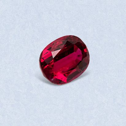Oval ruby on paper. 
Accompanied by a notice...