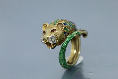 null A cast, chased and partially enamelled 18K (750) gold "roaring lion" ring, the...