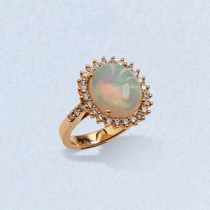 An 18K (750) yellow gold ring centered on...