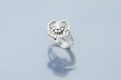  Platinum and 18K (750) white gold openwork flower ring set with old and modern brilliant-cut...