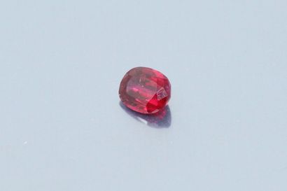 null Oval ruby on paper. 

Accompanied by a notice from the GEMPARIS laboratory stating...