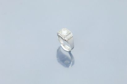  Platinum signet ring set with a brilliant-cut diamond and a line of three diamonds,...