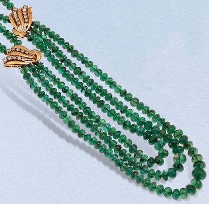  Necklace composed of three rows of falling emerald balls set with two lines of brilliant-cut...