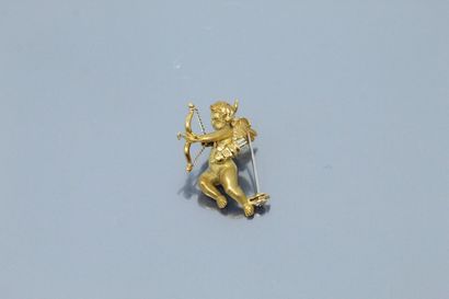  Broche en or jaune 18K (750) moulé, amati et ciselé figurant Cupidon. 
Dimensions...