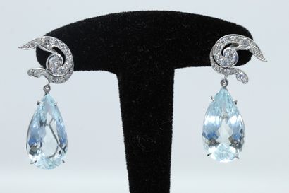  Pair of 18K (750) white gold and platinum earrings, composed of an ear motif drawing...