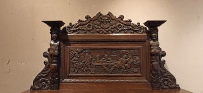 null 
Dresser in natural wood carved in the lower part of a decoration of scrolls,...