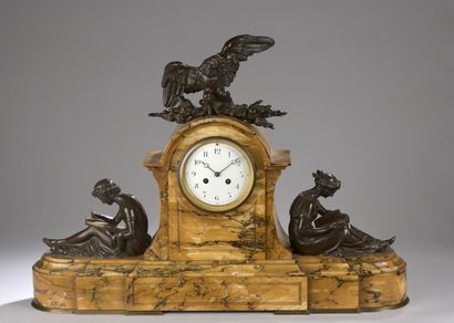 null Marble clock with two bronze figures with brown patina representing a woman...