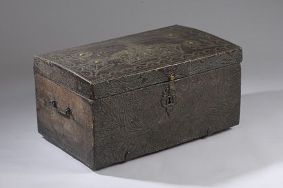 null A trunk with a slightly curved lid and an oak core covered with studded leather...