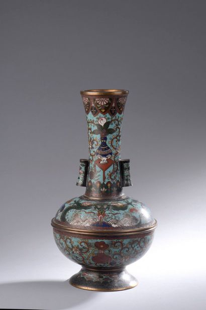 null JAPAN - About 1900

A bronze and polychrome cloisonné enamelled vase with a...