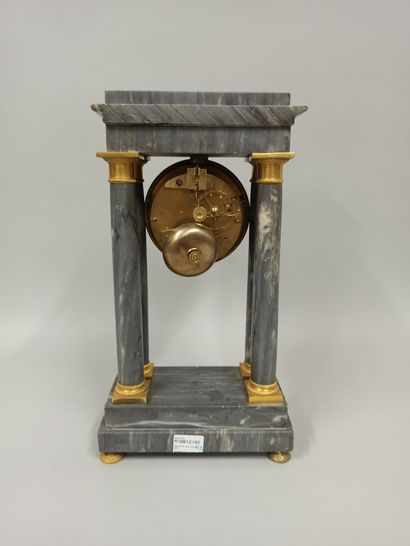 null A turquoise blue marble portico clock with four columns and a gilt bronze base...