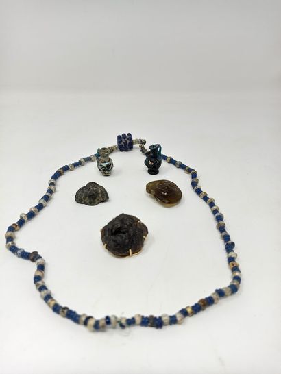 null Lot including a necklace of recomposed pearls, two small pendants in the shape...