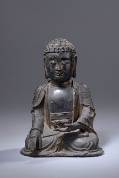 null CHINE - Epoque MING (1368 - 1644)

Statuette en bronze à patine brune à traces...