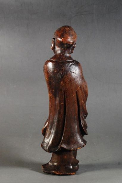 null CHINA - Early 20th century

Statuette of Luohan standing in carved wood, the...