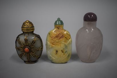 null CHINA - Early 20th century

Three snuff bottles, one in rock crystal carved...