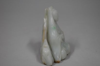 null CHINA - 20th century

Jadeite group of guanyin sitting on a rock. 

H.: 7,3...