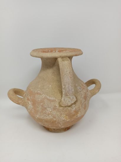 null Lot including a Phoenician oil lamp with cup and a hydria with oblique handle...