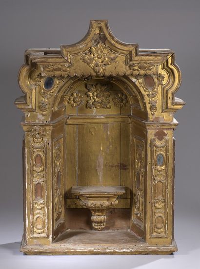 null A large carved and gilded resinous wood niche decorated with scrolls and flowers...