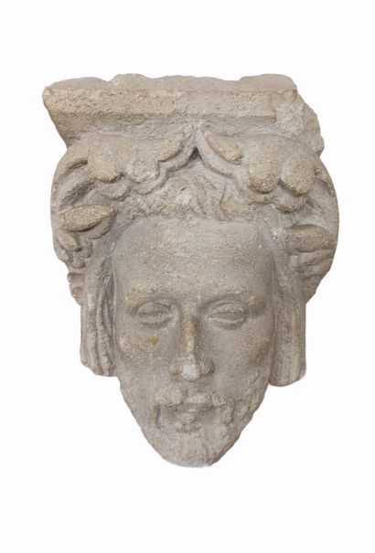 null Limestone console carved with a bearded man with foliage

16th century

H.:...