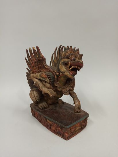 null INDONESIA, Bali

Carved and polychrome wooden statuette of Singha resting on...