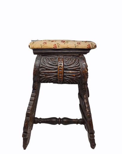 null Carved and gilded walnut stool. Carved legs connected by a turned crosspiece,...