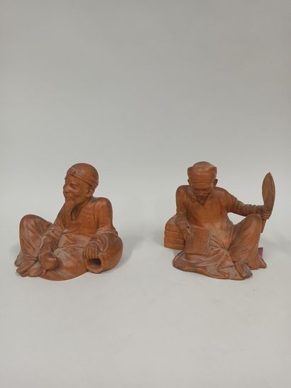 null VIETNAM - 20th century

Two statuettes of seated scholars, one holding a peach...
