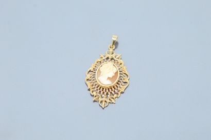  An 18k (750) yellow gold pendant set with a shell cameo representing the portrait...