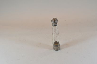 null Perfume bottle in engraved glass decorated with a stopper and a bottom of silver...