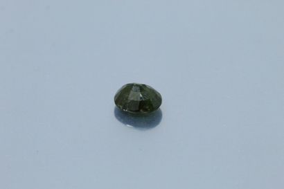 null 
Oval green tourmaline on paper. 




Weight : 5.12 cts.
