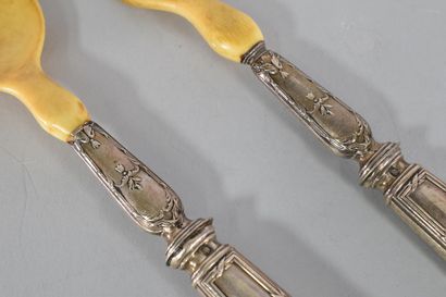 null Serving utensils, the handles in silver and monogrammed, filigree decoration....