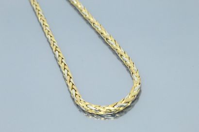 null Collier tressé en or jaune et gris 18k (750).

Tour de cou : 44.5 cm. - Poids...