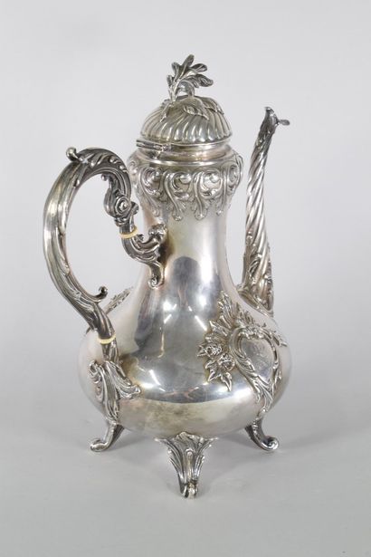 null Four-legged silver teapot (Minerva), the body decorated with monogrammed cartouches...