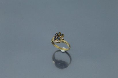  18k (750) yellow gold ring set with navette sapphires and small diamonds. 
Finger...