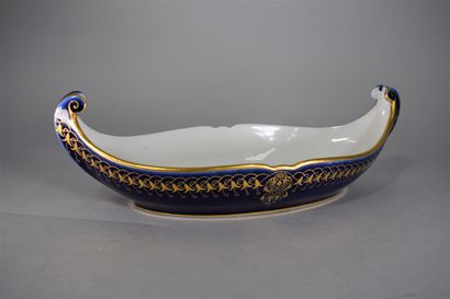 null SEVRES 

Gondola-shaped cup in blue porcelain with a gilded frieze of brugmansia...
