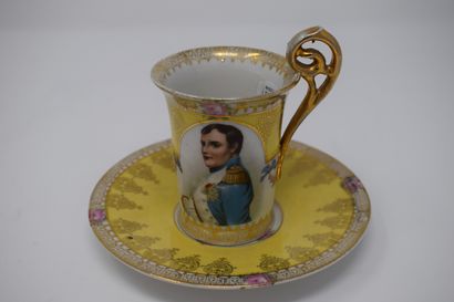 null Two cups and saucers, 

One with a yellow background decorated with a portrait...