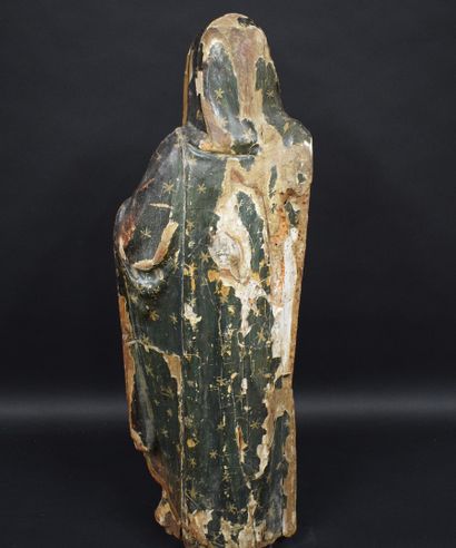null 
Polychrome wood sculpture representing a woman draped in a garment with floral...