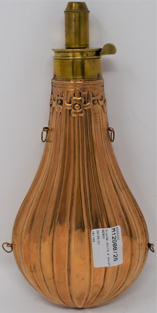 null Large pear-shaped powder flask decorated with a brass balloon with four suspension...