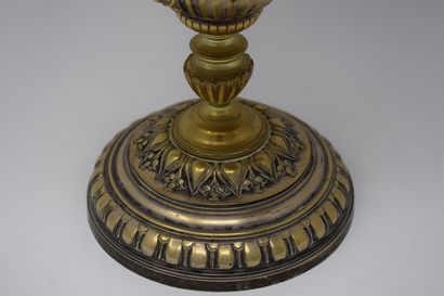 null In the taste of Barbedienne, 

Cup on foot in bronze and brass with central...