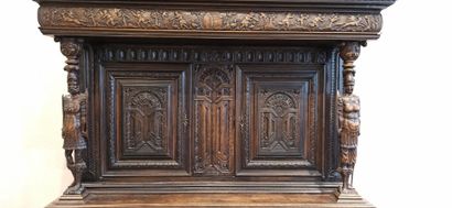 null 
Dresser in natural wood carved in the lower part with a decoration of foliage,...