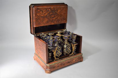 null 
Wooden liquor cabinet inlaid with scrolls, complete with its sixteen glasses...