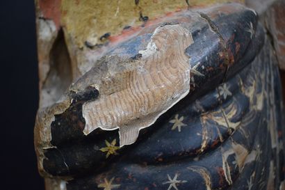 null 
Polychrome wood sculpture representing a woman draped in a garment with floral...